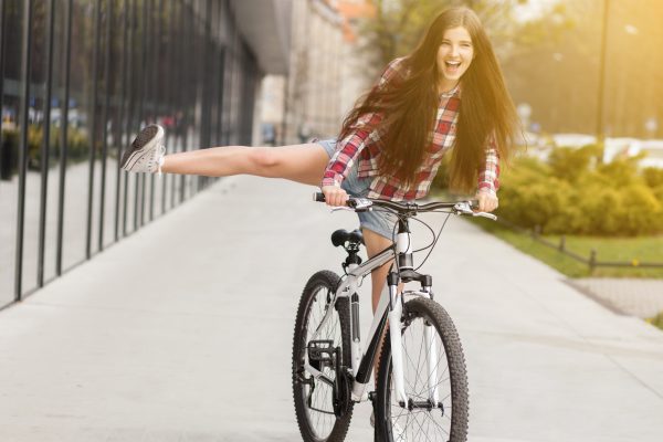 Young Beautiful Woman On A Bicycle.